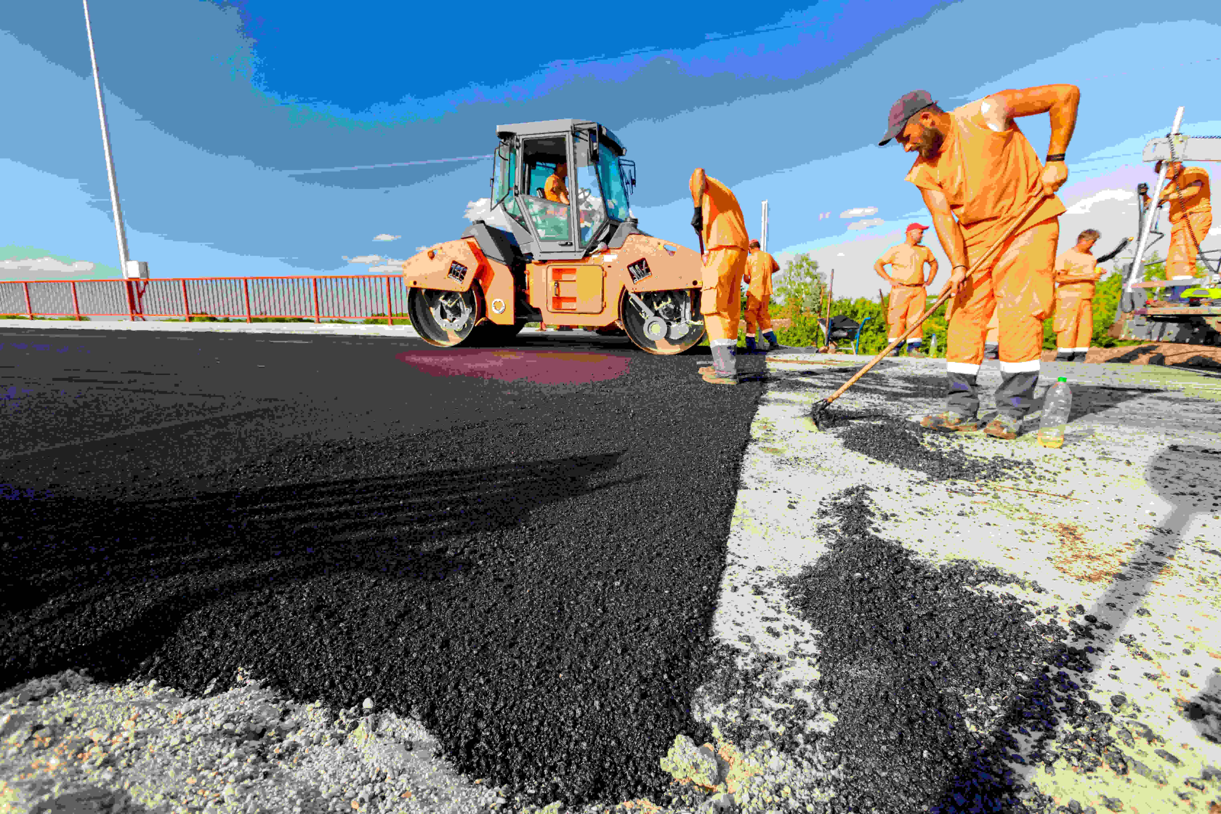 Skilled asphalt paving team resurfacing roads with quality craftsmanship in Cumming