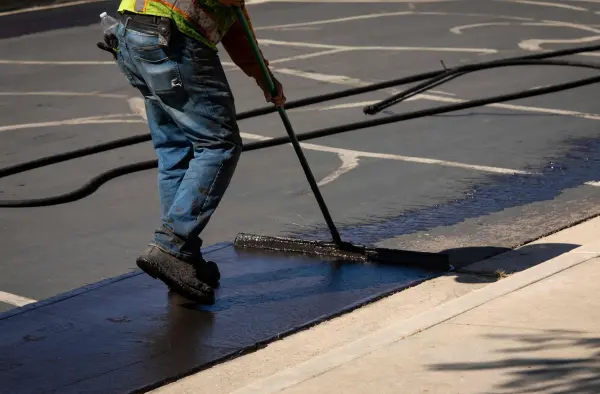 North Georgia asphalt sealcoating service using brush application for pavement protection