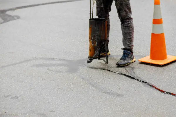 Asphalt crack sealing service in North Georgia with hot rubber application for durable pavement protection.